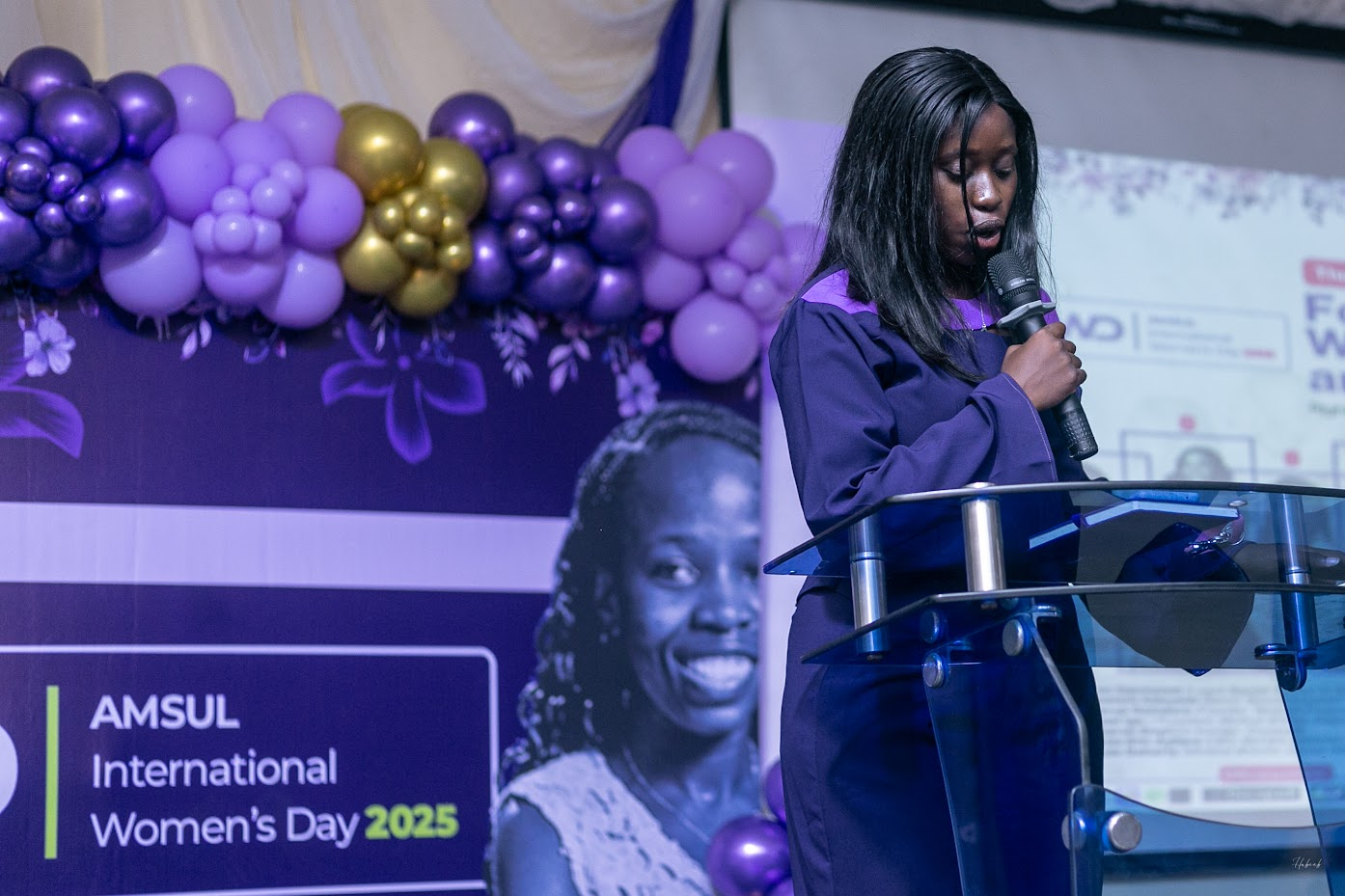 An AMSUL speaker addressing an audience at a lectern
